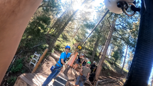 Zipliner approaching the landing deck in the Rocky Mountains