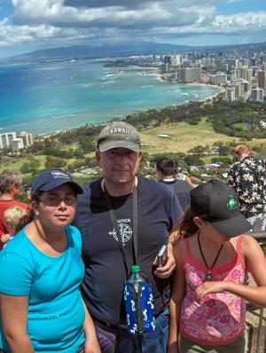 A hiker looks out over Waikiki from the summit of Diamond Head