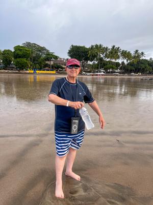 Man sitting on Tamarindo Diria Beach Resort lounge chair